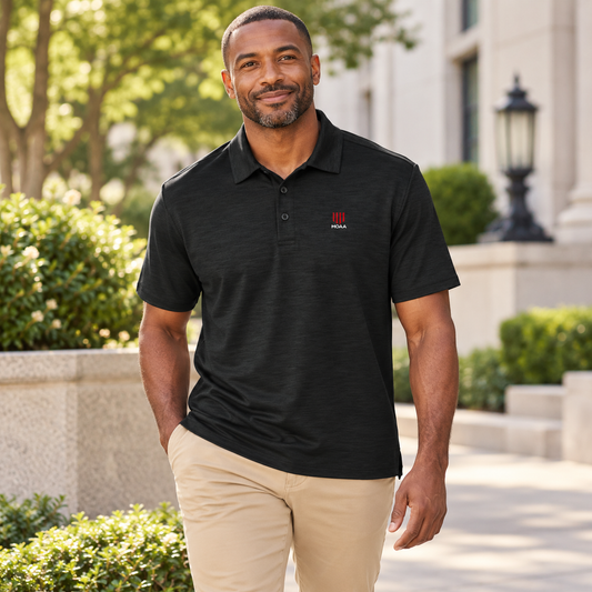 Adult man wearing the Men's MOAA Polo in a lifestyle setting.