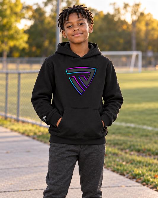 Boy wearing the black Youth Built for Battle Cyber Hoodie with neon shield beside a sports field