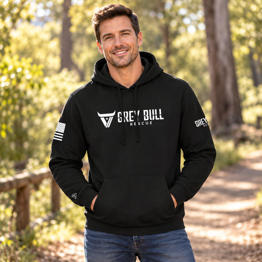 Man wearing the Grey Bull Rescue Black Hoodie outdoors.