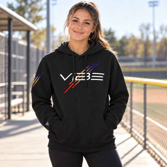 Lifestyle view of Vibe Softball Hoodie at an athletics setting.