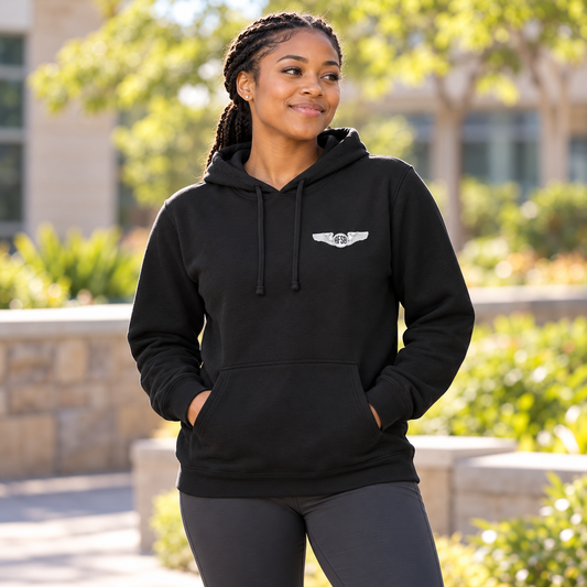 AFSA Hoodie worn by an adult woman in a sunlit landscaped community courtyard; front view.