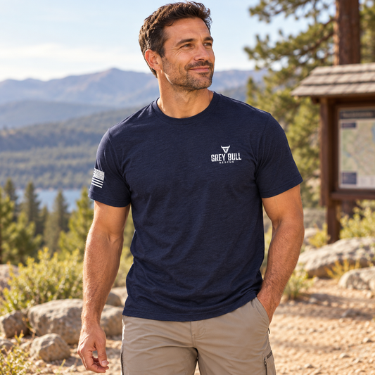 Grey Bull Rescue No Spectators Navy Tee worn by an adult man outdoors; front view.