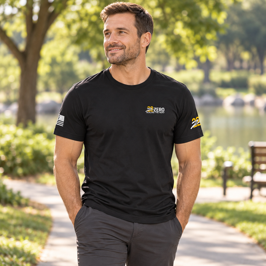 Healing the Hero Black Tee worn by an adult man outdoors; front view.
