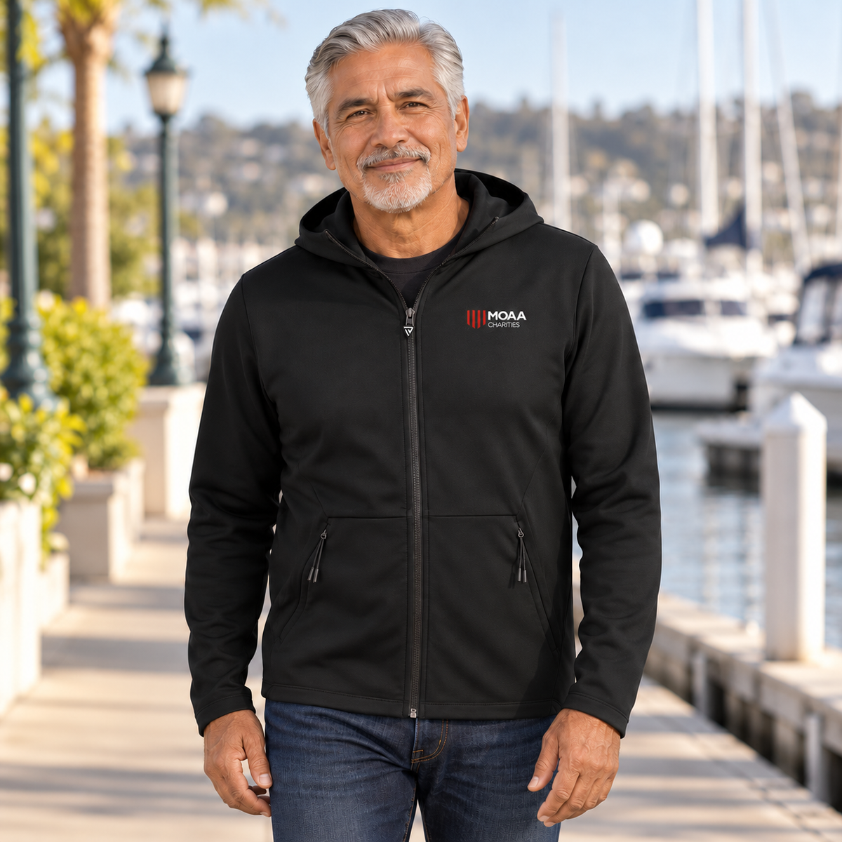 Older adult man wearing the Men's MOAA Charities Elite Full-Zip in a lifestyle setting.