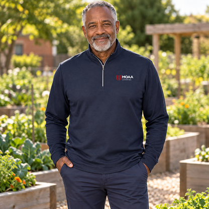 Older adult man wearing the Men's MOAA Charities Quarter Zip in a lifestyle setting.