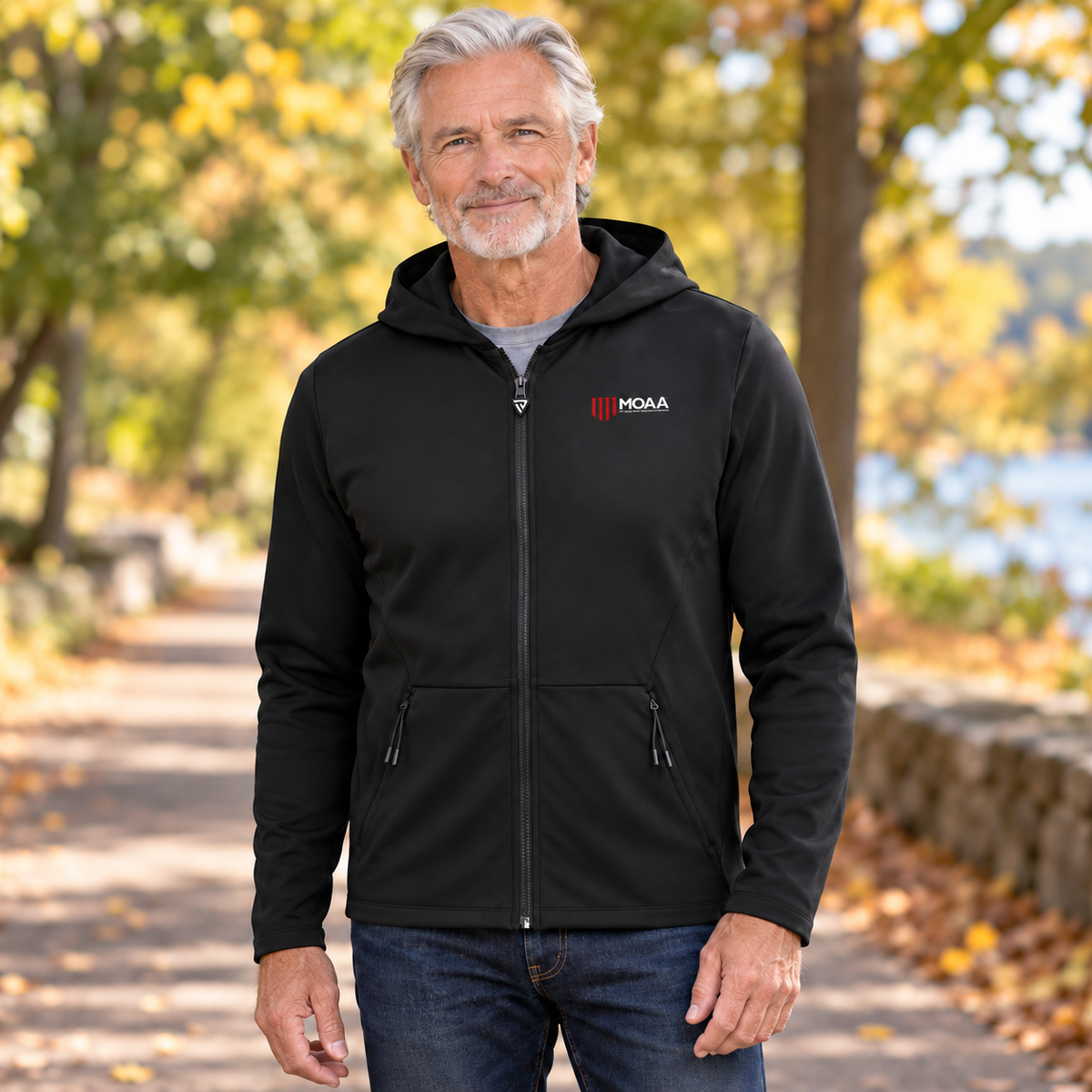 Older adult man wearing the Men's MOAA Elite Full-Zip in a lifestyle setting.