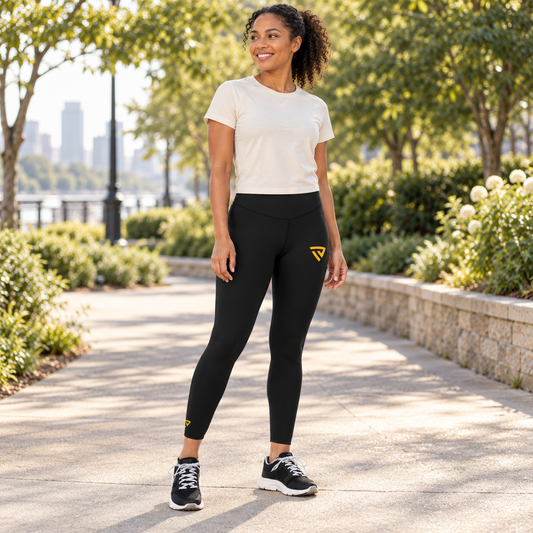 Women's Leggings worn by an adult woman in a quiet landscaped urban park walking path in warm morning light; front view.