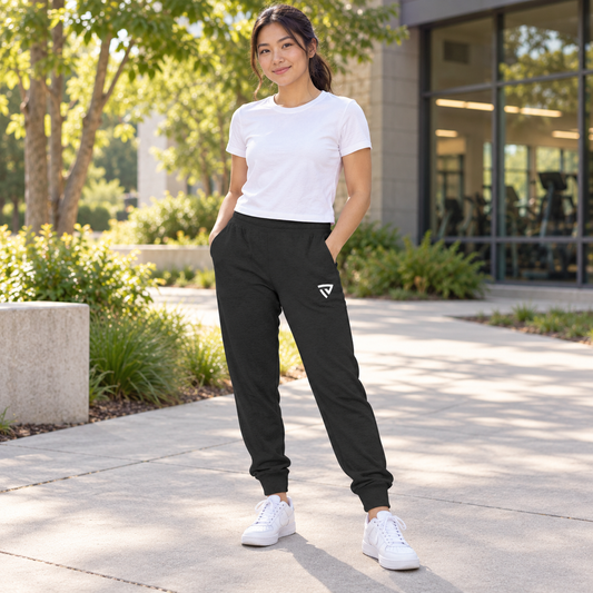 Women's Classic Joggers worn by an adult woman in a landscaped campus path outside a recreation center; front view.