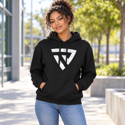 Women's Built For Battle Hoodie worn by an adult woman in a bright sports-center walkway with concrete and leafy trees softly blurred behind; front view.