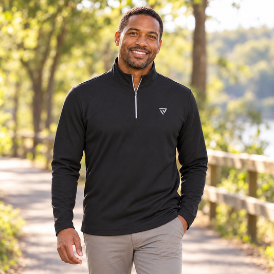 Man wearing the True Victory Black Quarter Zip outdoors.