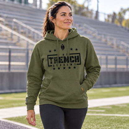 Lifestyle view of Trench Hold the Line Military Green Hoodie at an athletics setting.