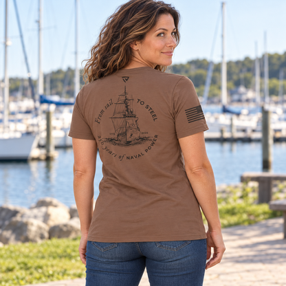 Back view of Navy 250th Birthday Coyote Brown Tee by the water.