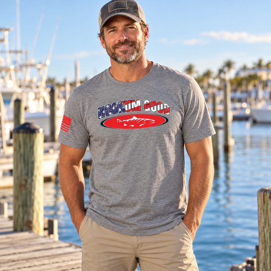 Man wearing the gray Hookum Good Flag Tee on a marina dock.