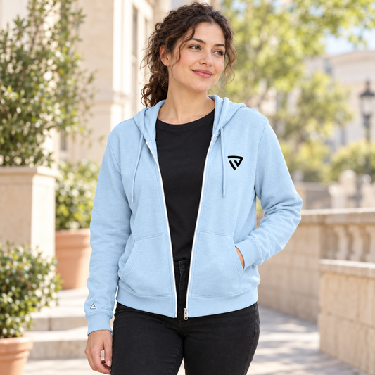 Woman wearing the ice blue Women's Legacy Full Zip Hoodie on a neighborhood terrace