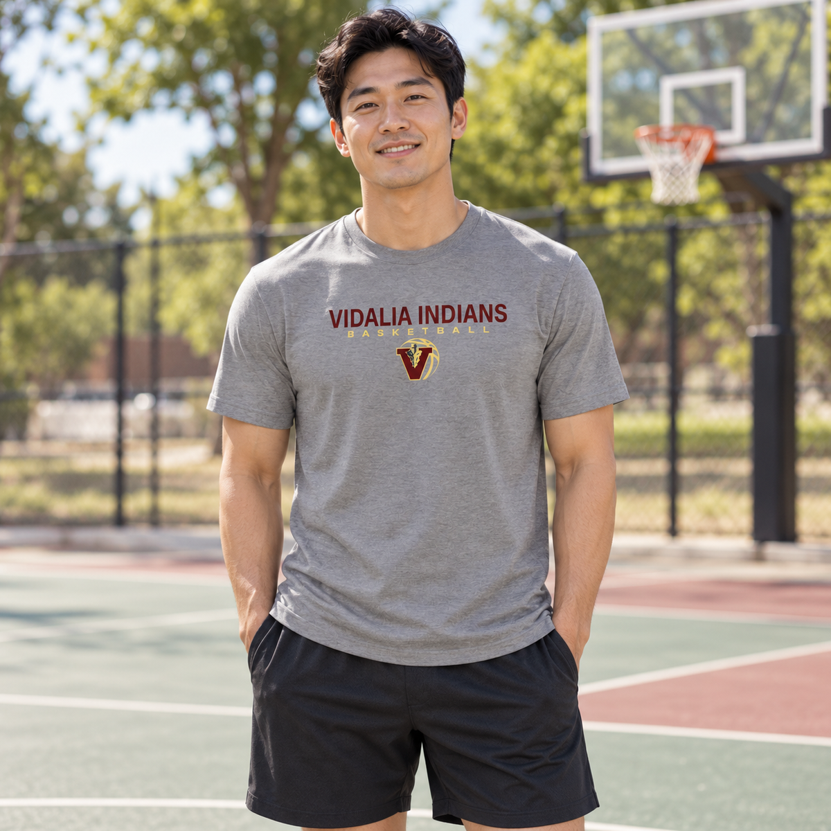 Man wearing the Vidalia basketball travel tee in Heather Gray