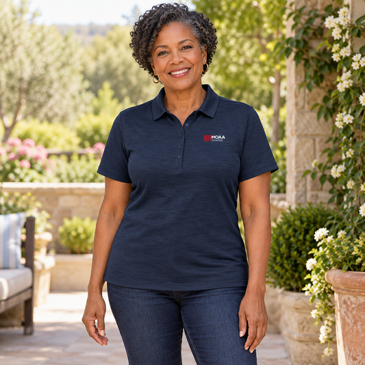 Older adult woman wearing the Women's MOAA Charities Polo in a lifestyle setting.