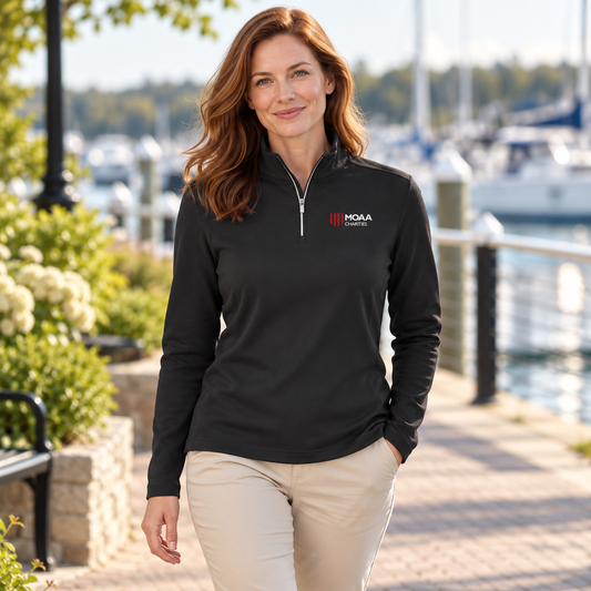 Adult woman wearing the Women's MOAA Charities Quarter Zip in a lifestyle setting.