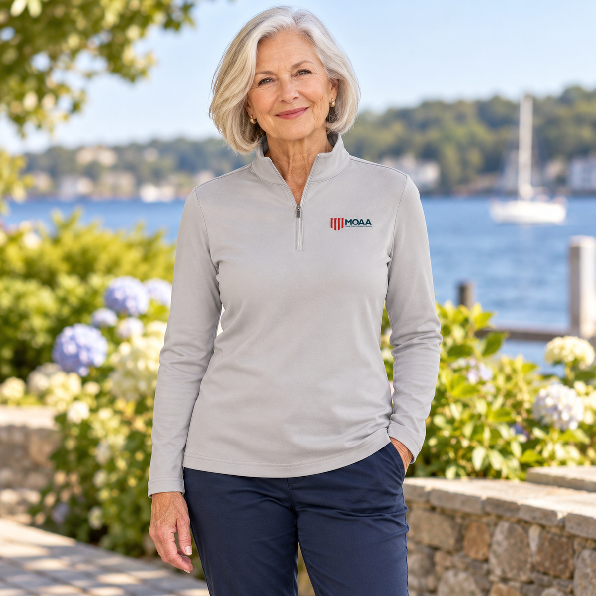 Older adult woman wearing the Women's MOAA Quarter Zip in a lifestyle setting.