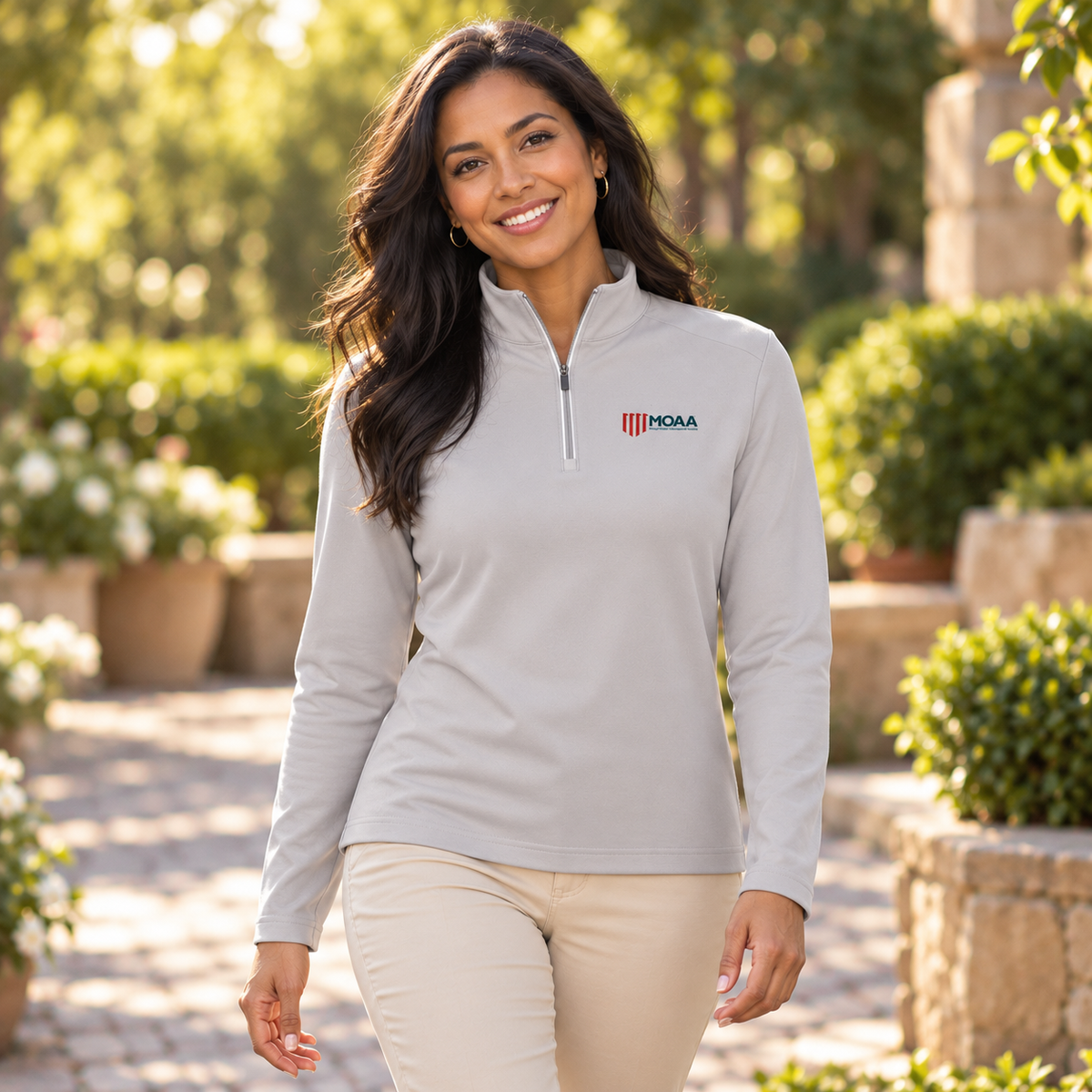 Younger adult wearing the Women's MOAA Quarter Zip in a lifestyle setting.