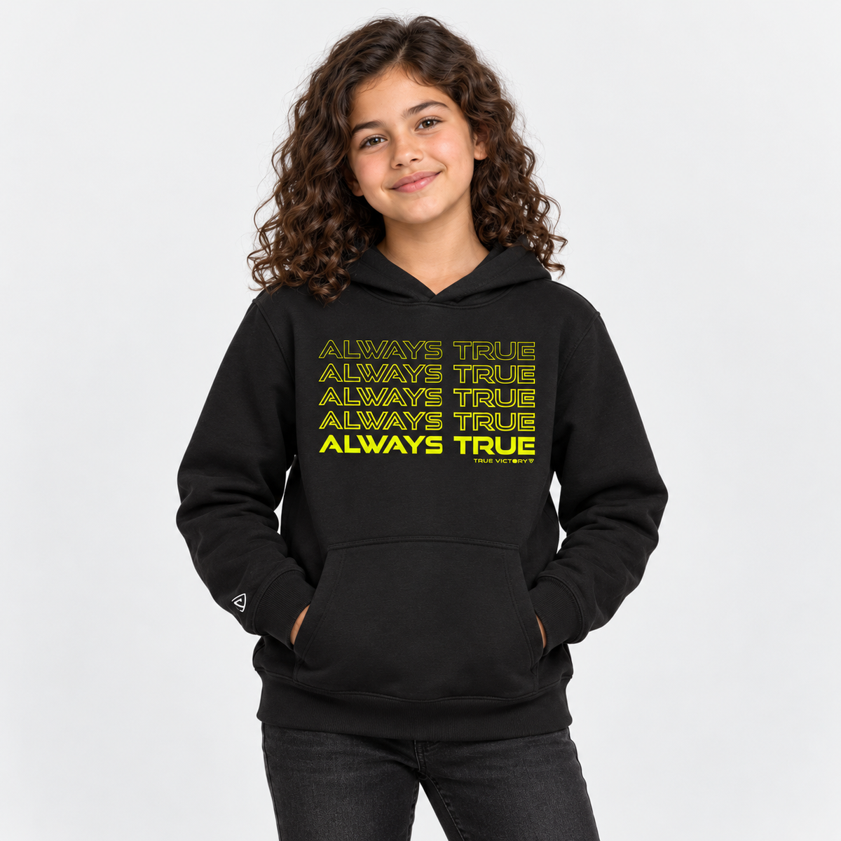 Child model wearing the youth Always True Stacked Hoodie in black with neon yellow print