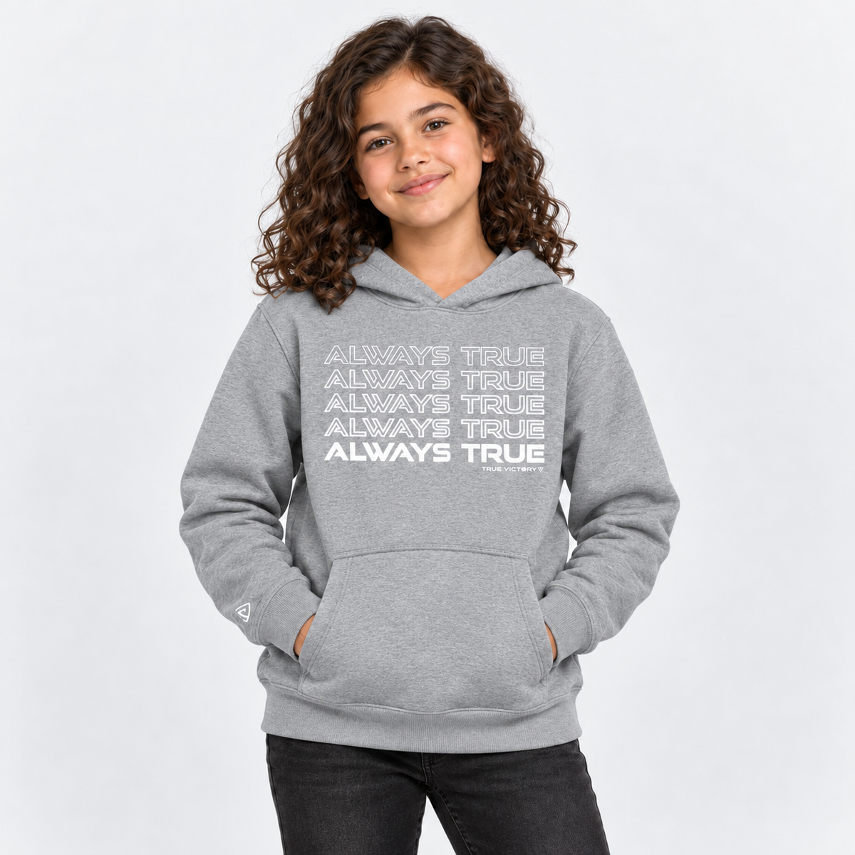 Child model wearing the Youth Always True Stacked Hoodie in dark heather gray with white print